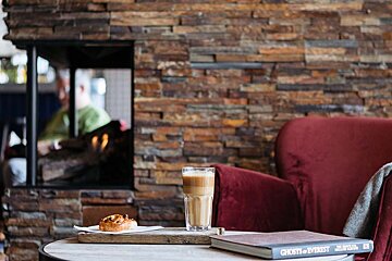 A book titled ghosts of everest sits on a table
