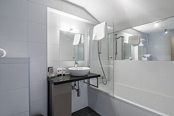 A bathroom with a sink and a bathtub