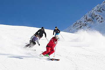 a ski instructor giving a private lesson