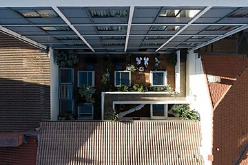 An aerial view of a building with a rooftop garden
