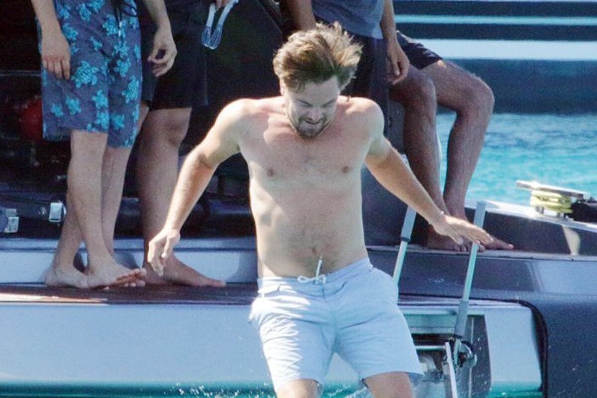 leo jumps off the yacht into the water in ibiza