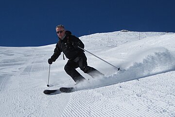 skier on corduroy snow