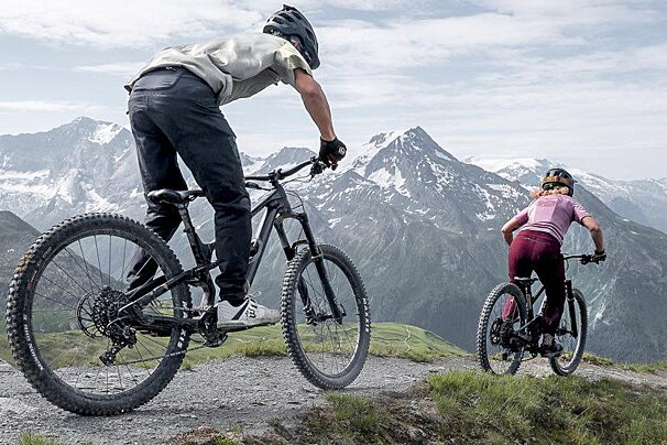 A man riding a bike with the word fox on the front