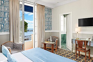 A hotel room with a view of the ocean