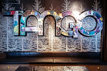 The word tango that is on a wall