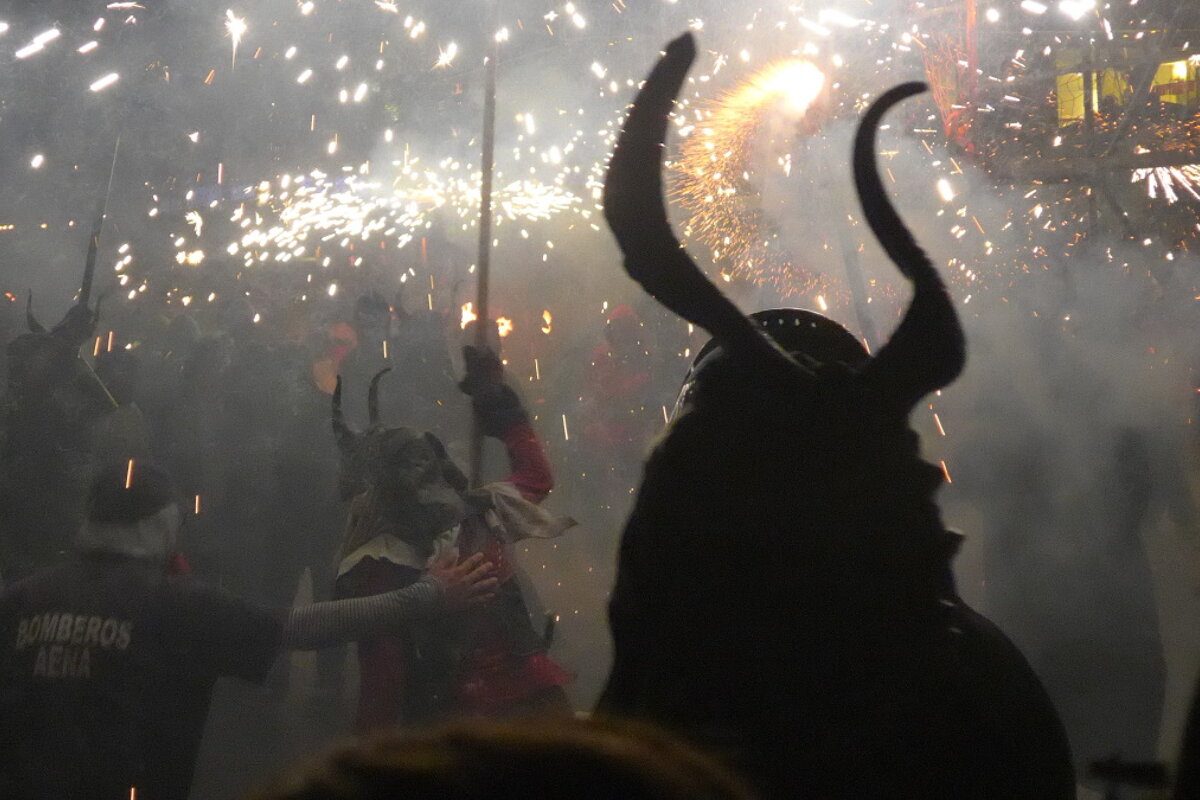 horned people and a fireman controlling the mayhem