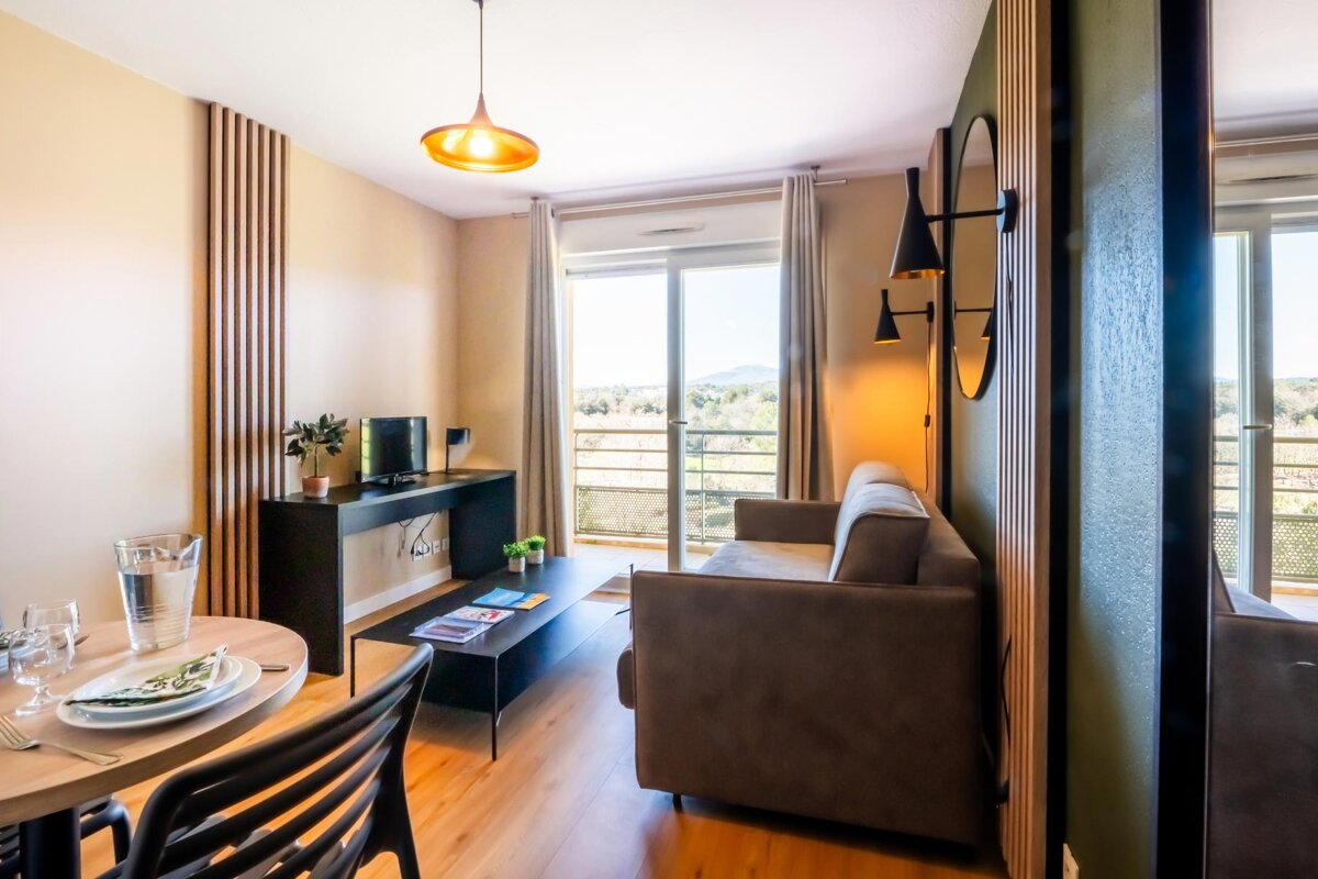 A living room with a couch and a table