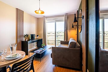 A living room with a couch and a table