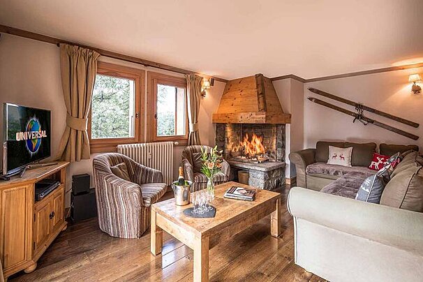 A living room with a television that says universal on it