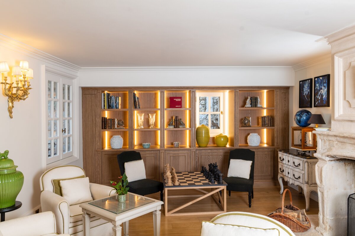 A living room with a chess board on the table