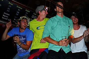 An image of a group of Swedish men dancing on a bar in Chamonix Mont Blanc