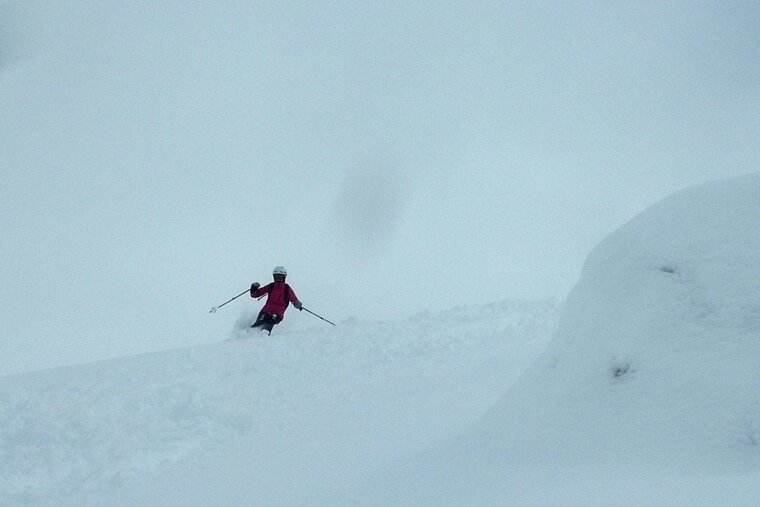 a skier in low clouds