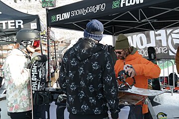 people looking at new snowboards