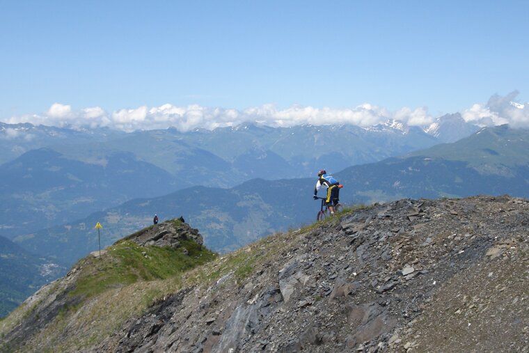 a mountain biker on a ridge line