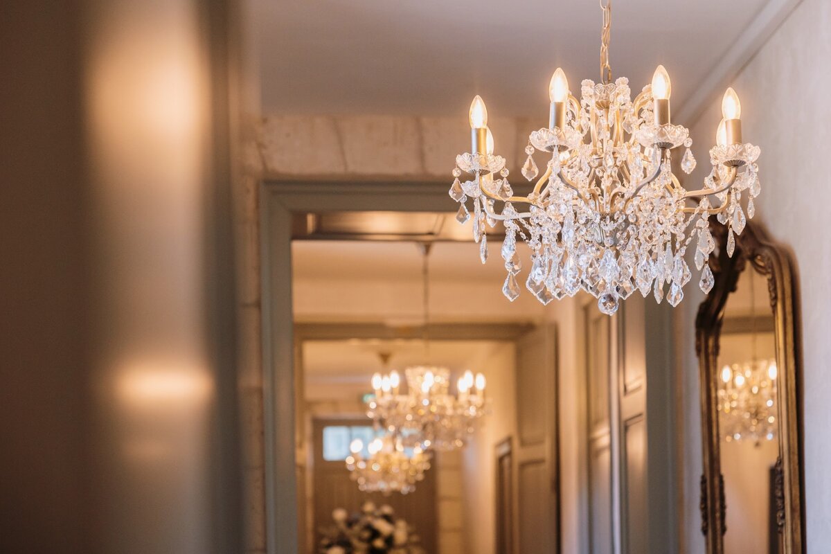 A hallway with a chandelier hanging from the ceiling