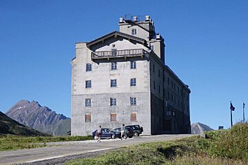 a stone building on the road side near les arcs