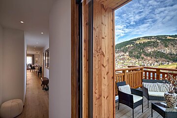 A balcony with a view of a mountain range