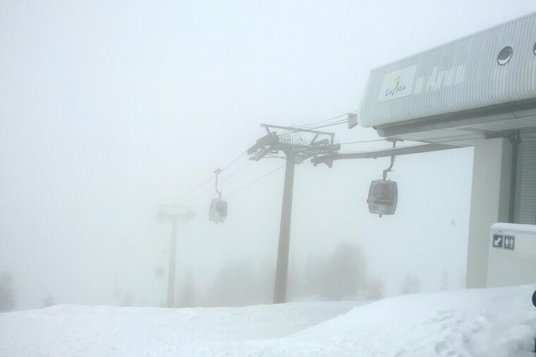 Transarc bubble in a whiteout, pylons, snow and trees
