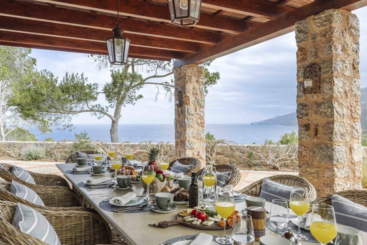 A table with glasses of orange juice on it