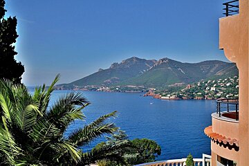 A view of a body of water with mountains in the background