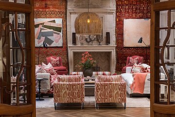 A living room filled with furniture and a fireplace