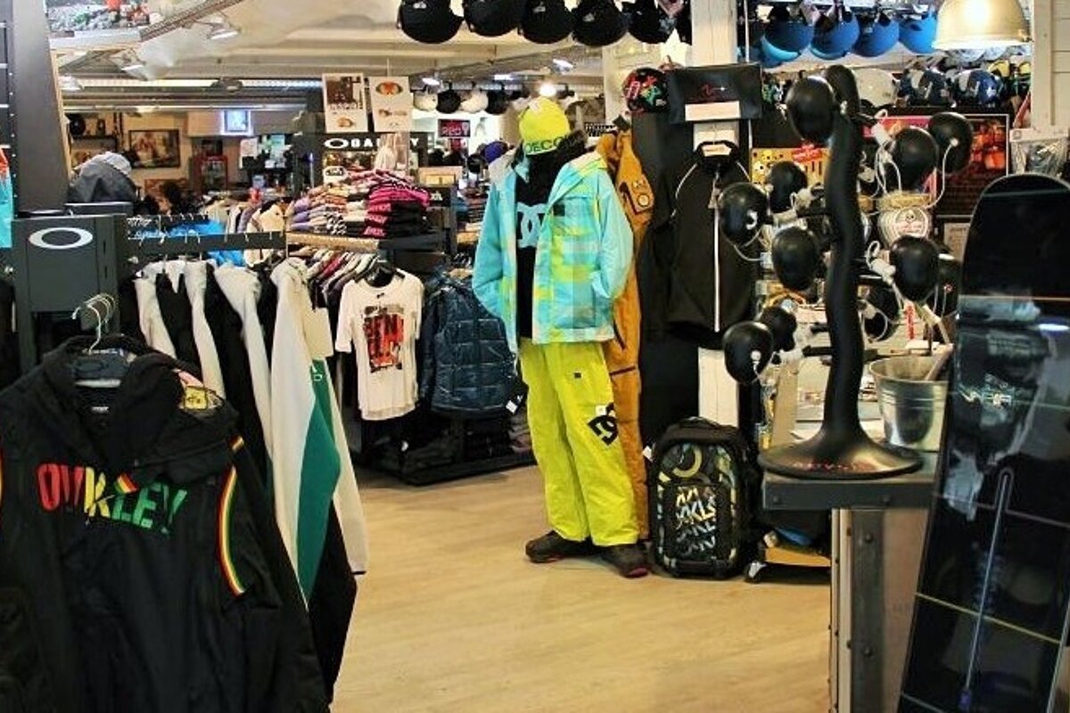 A oakley shirt hangs on a rack in a store