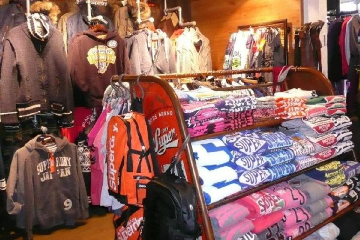 A display of superdry shirts and jackets in a store