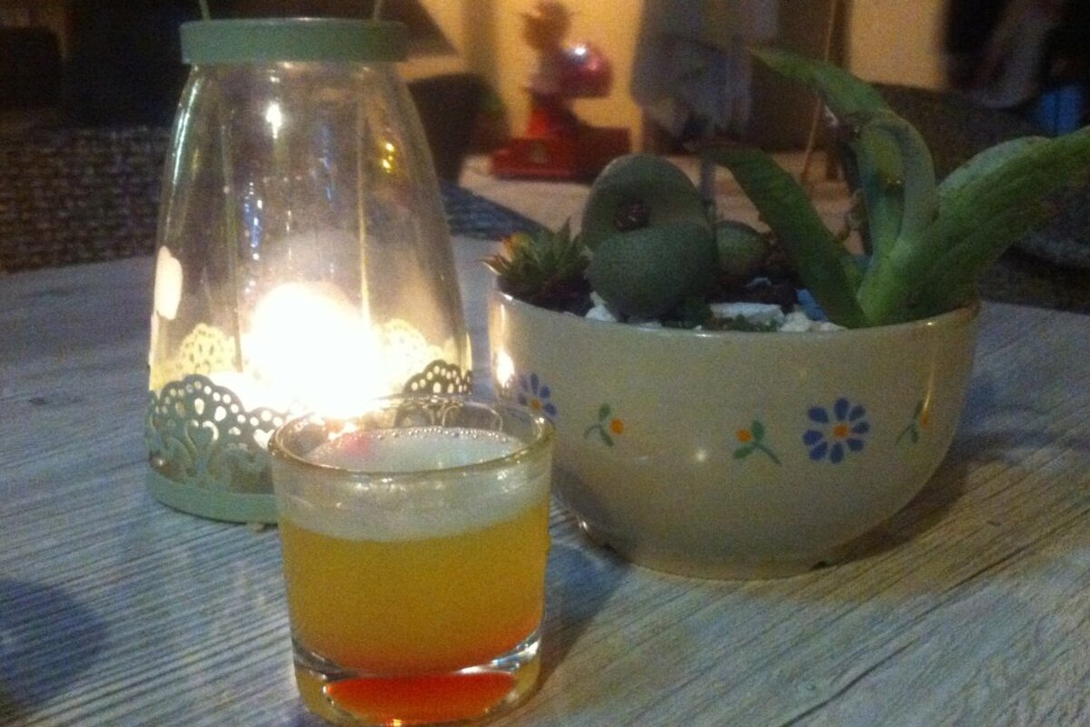 a mini cocktail on a wooden table