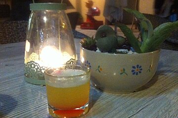 a mini cocktail on a wooden table