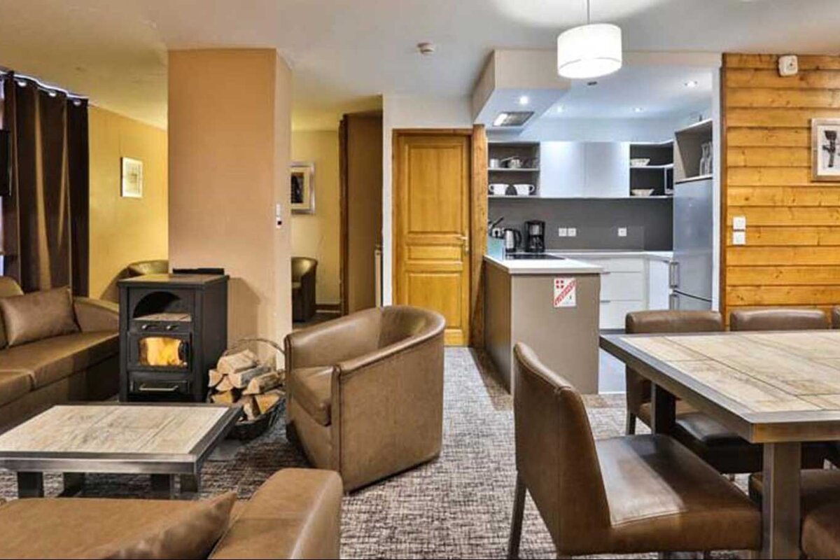 A living room with a fireplace and a table