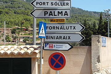 signs marking a walking path