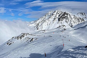 Skiing on the pistes in Val Thorens on a sunny day