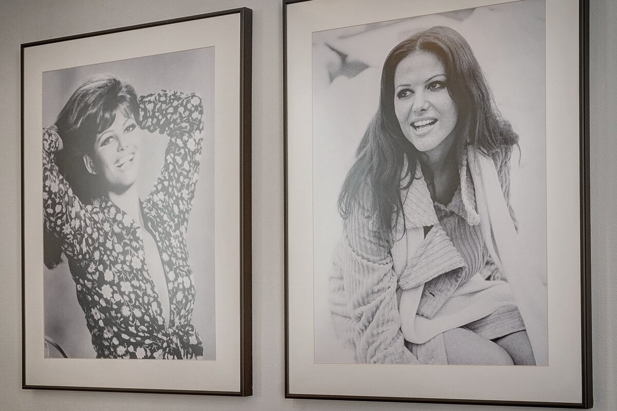 Two framed pictures of a woman are hanging on a wall