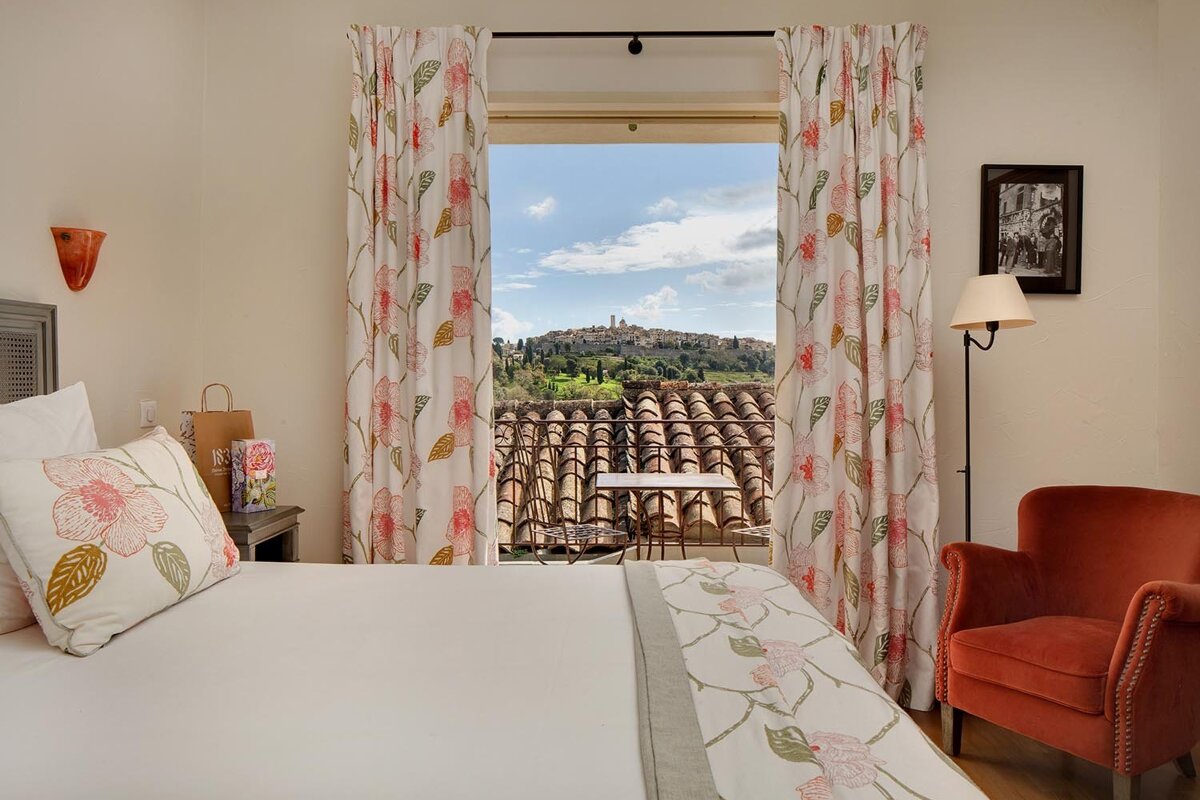 A hotel room with a view of a mountain
