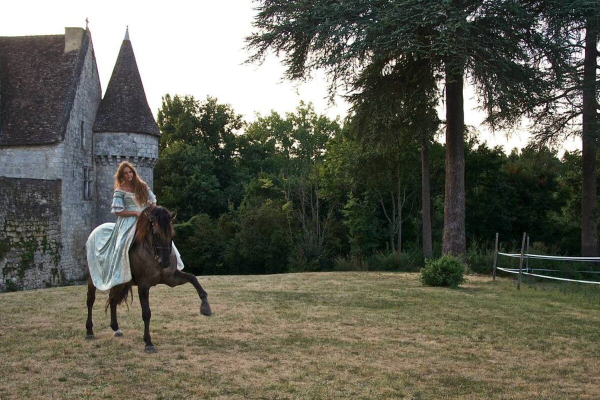 girl on horse at Chateau de Bridoire, Bergerac