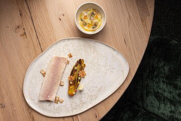 Fish dish plated on a table at Alpage restaurant Courchevel