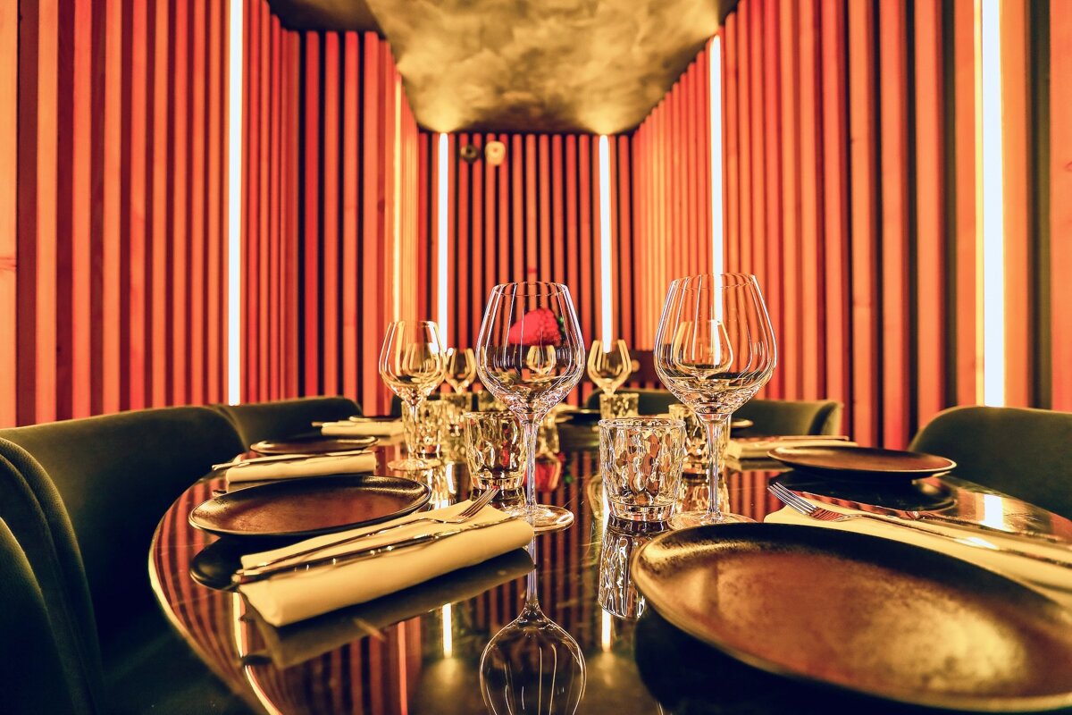 A table set with plates and glasses in a restaurant