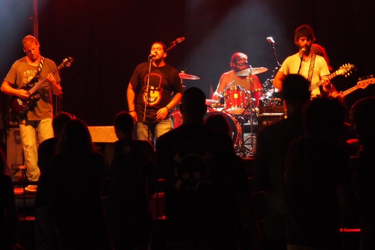 a singer and a band on stage in mallorca