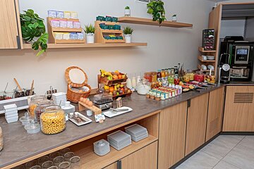 A buffet with a sign that says ' eggs ' on it