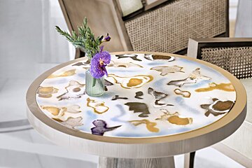 A table with a vase of flowers on it