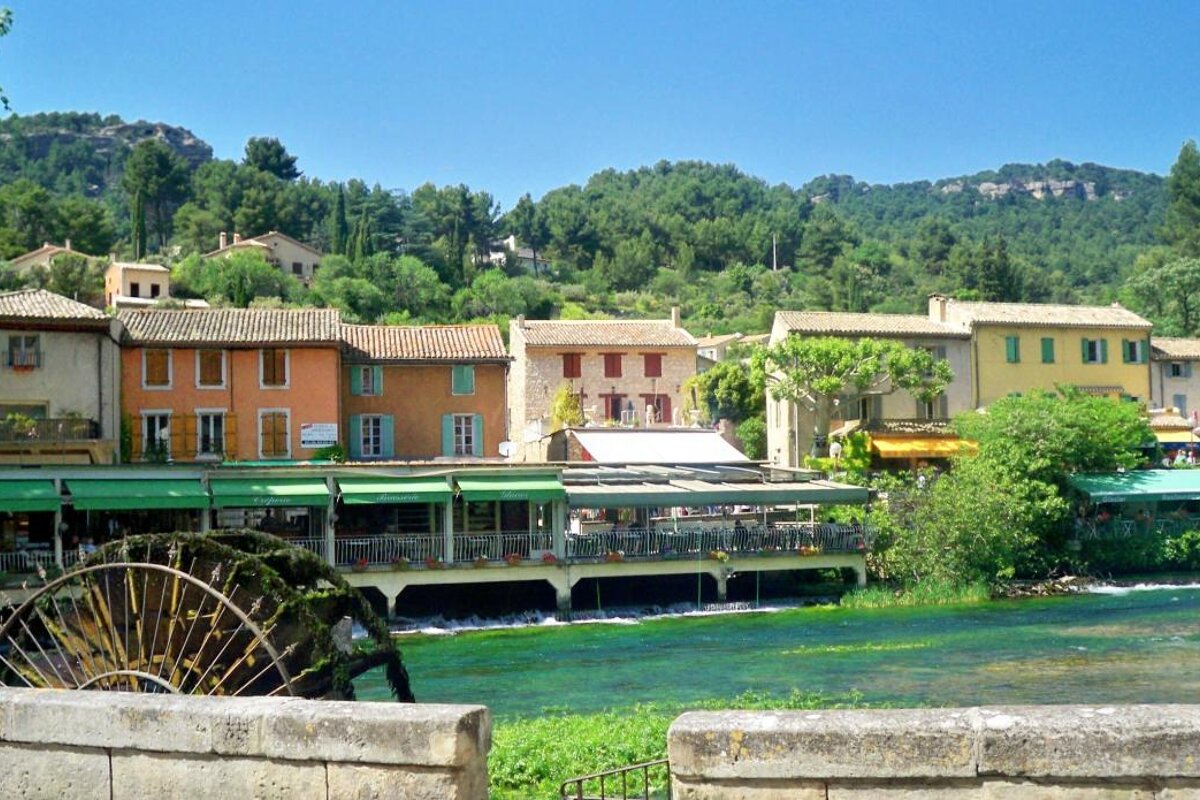 The river Sorgue and village of Fontaine de Vaucluse