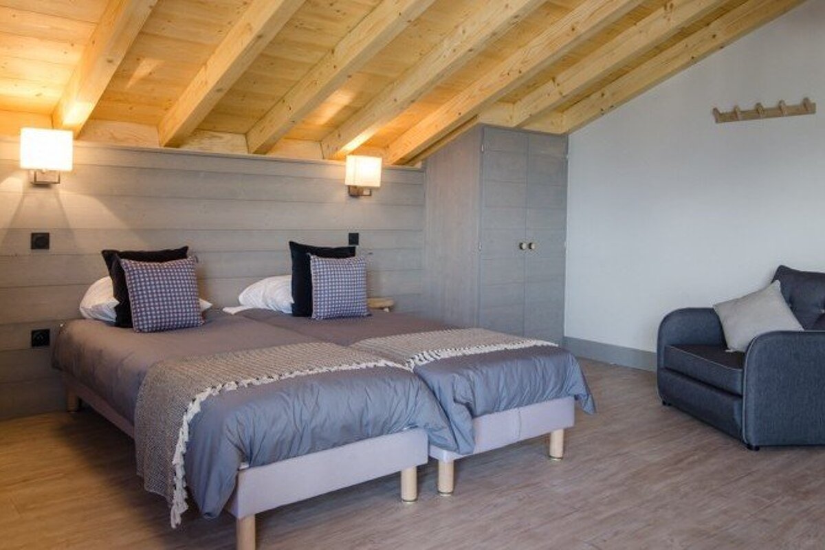 a room with multiple beds for families