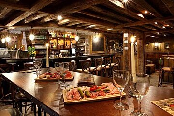 A restaurant with a few plates of food on the table