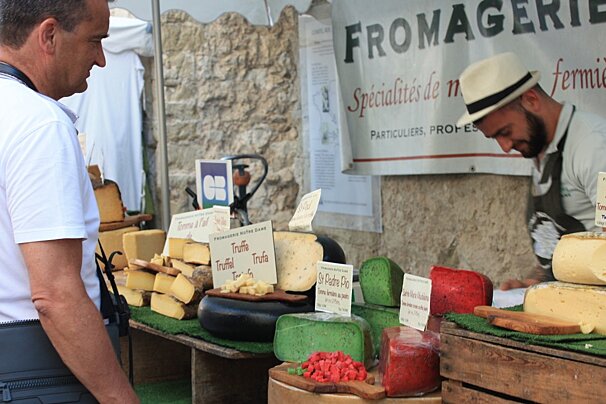 cheese for sale in a market in provence