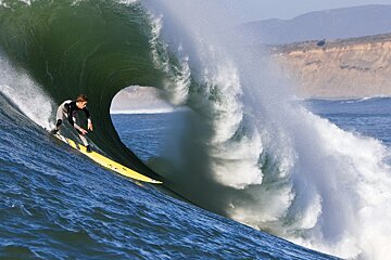 a surfer in a big wave