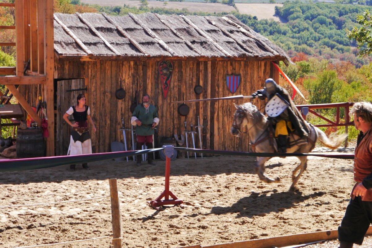 a man jousting on a horse in a show at rocamadour