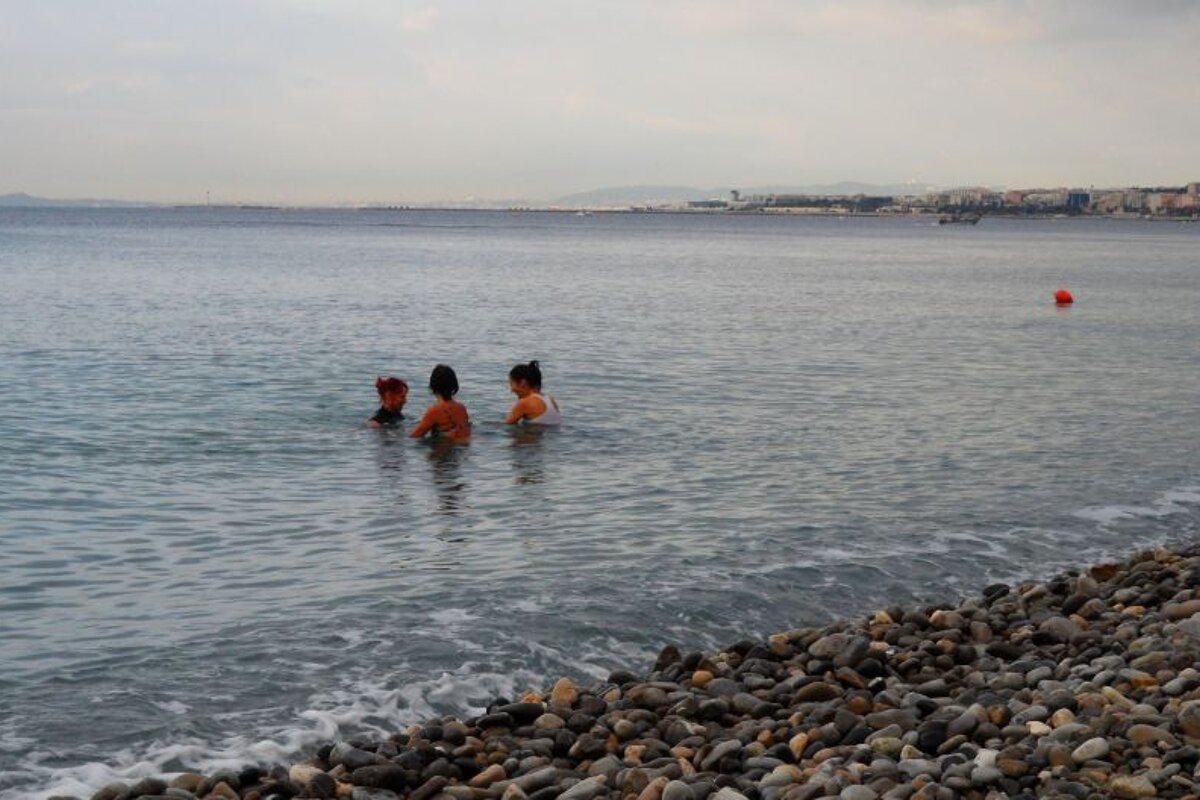 a coach with two people on submerged bikes