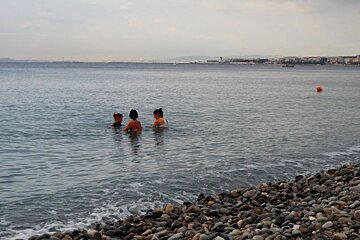a coach with two people on submerged bikes