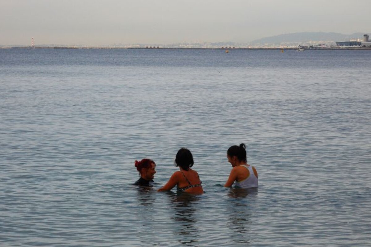 two women on bikes in the seas off Nice