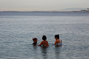 two women on bikes in the seas off Nice